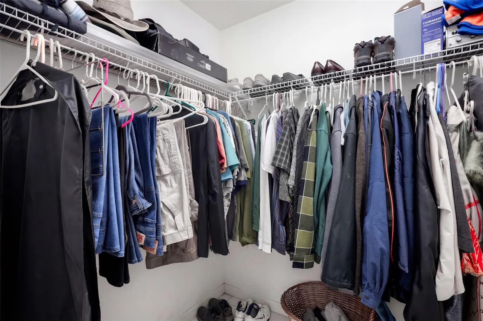 A walk-in closet provides organized storage for clothing and accessories.