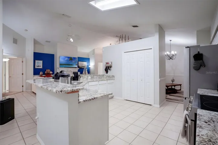 The open layout keeps the kitchen, dining, and living spaces connected.