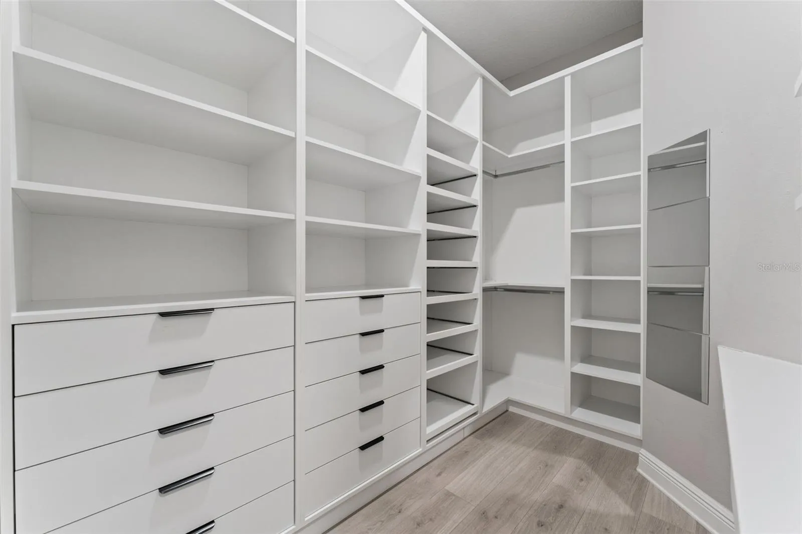 Large walk-in closet offering excellent storage and organization space.