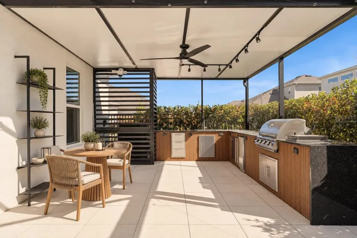 Virtually Staged! Covered outdoor living space perfect for enjoying Florida weather.