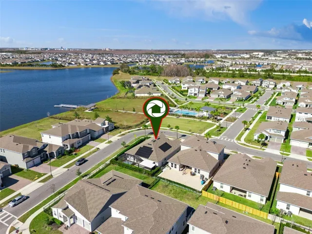 Aerial view showing the community’s scenic surroundings and nearby water views.