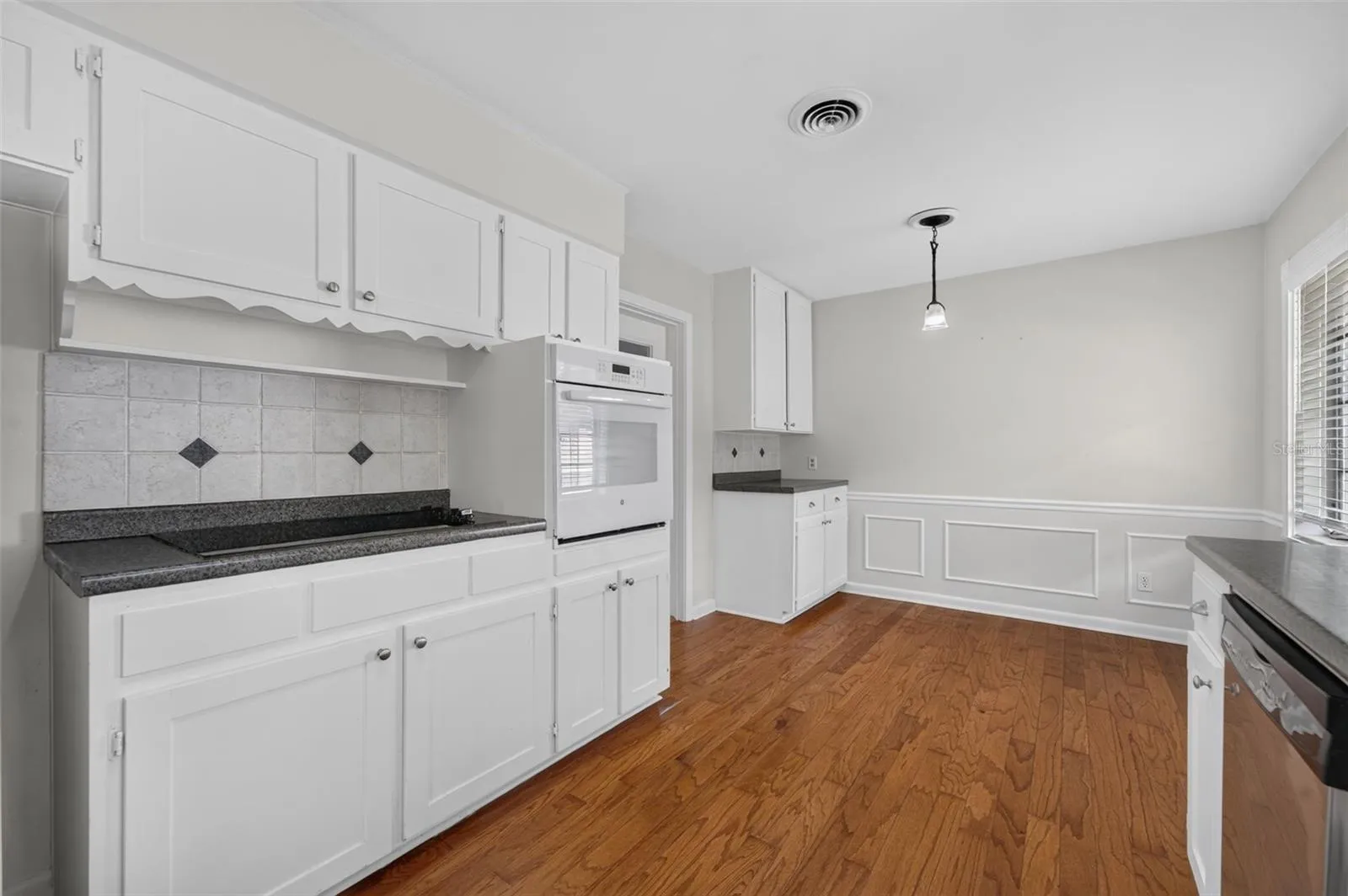 Eat-In Kitchen — Eat-in nook provides casual dining space and convenient access to the garage for bringing in groceries.