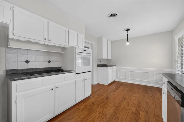 Eat-In Kitchen — Eat-in nook provides casual dining space and convenient access to the garage for bringing in groceries.