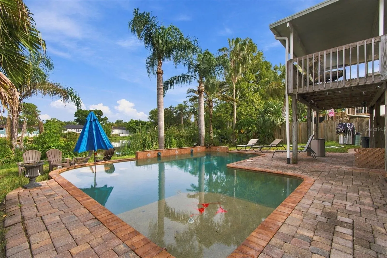 Pool deck w/ view of lake