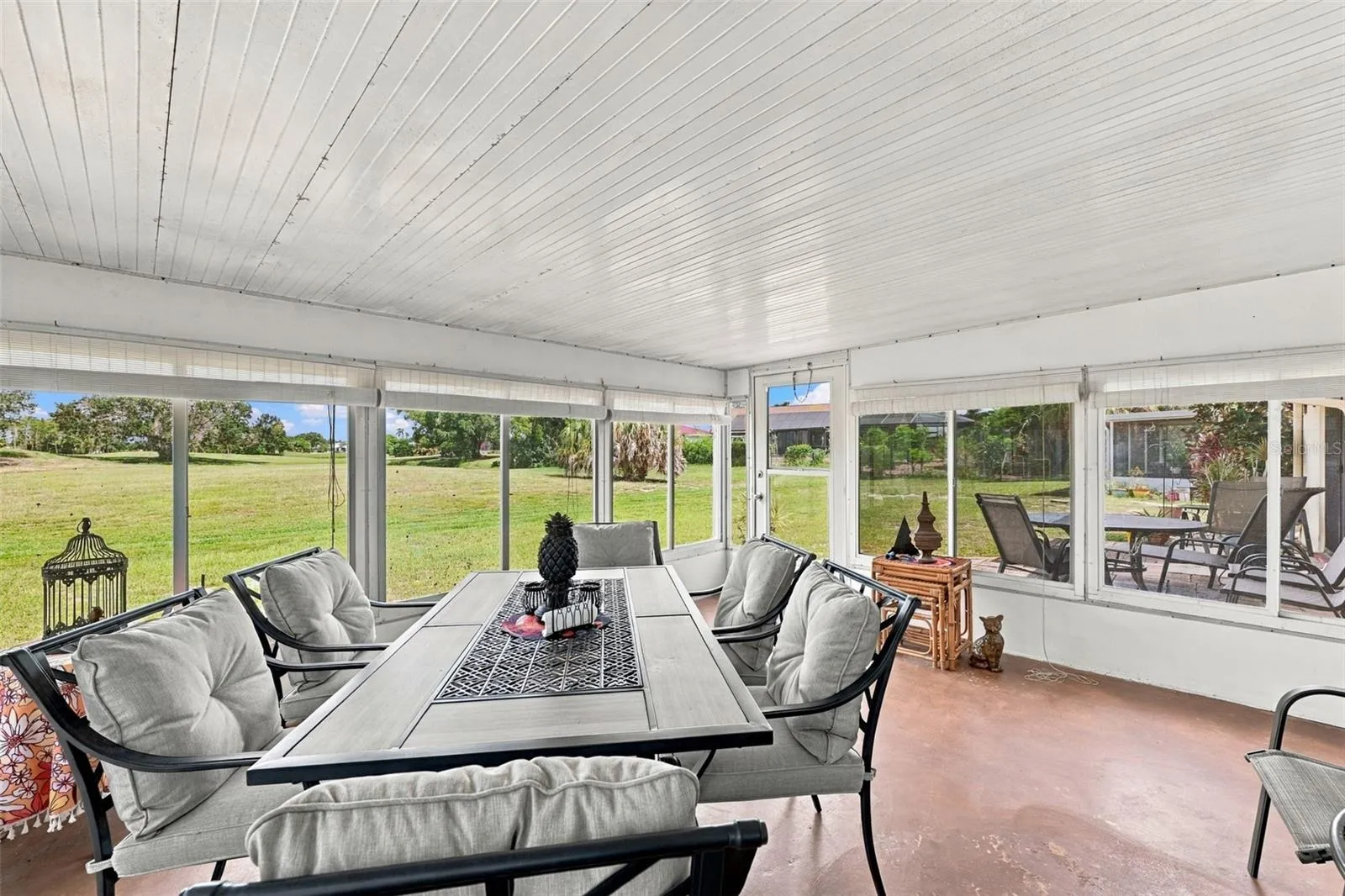 The Florida room has large windows so that you can enjoy this space year round.  What a view!
