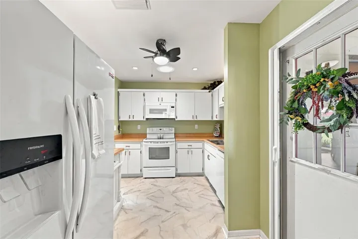 The kitchen is a very nice size and the door to the garage has a screen door attachment, so that you can open the garage door and let the sea breezes blow through the home.