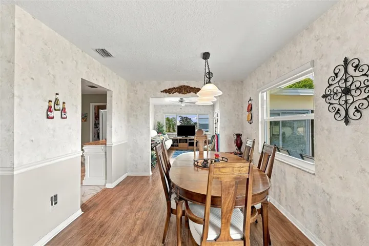 The dining area next to the large new window is the perfect spot to enjoy a meal or puzzle.
