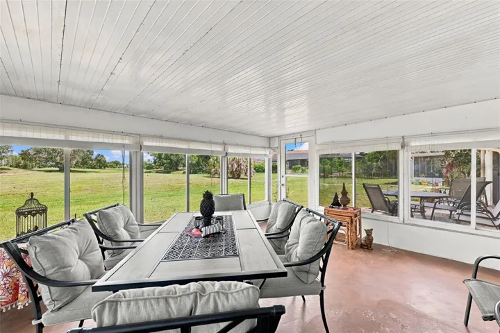 The Florida room has large windows so that you can enjoy this space year round.  What a view!