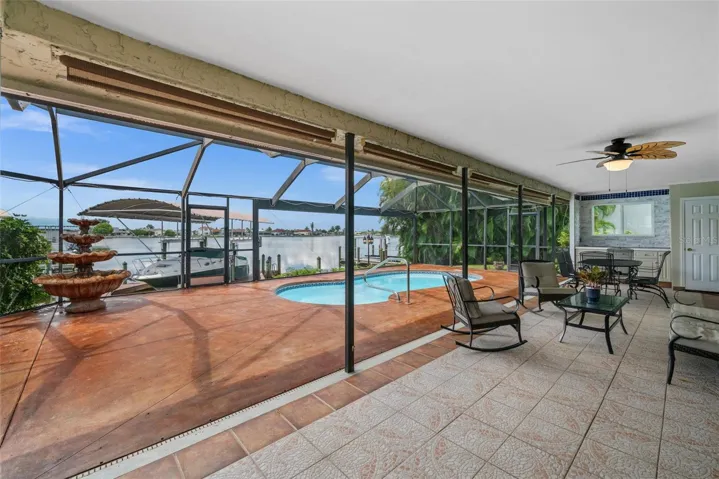 Large covered lanai overlooking the pool and lake