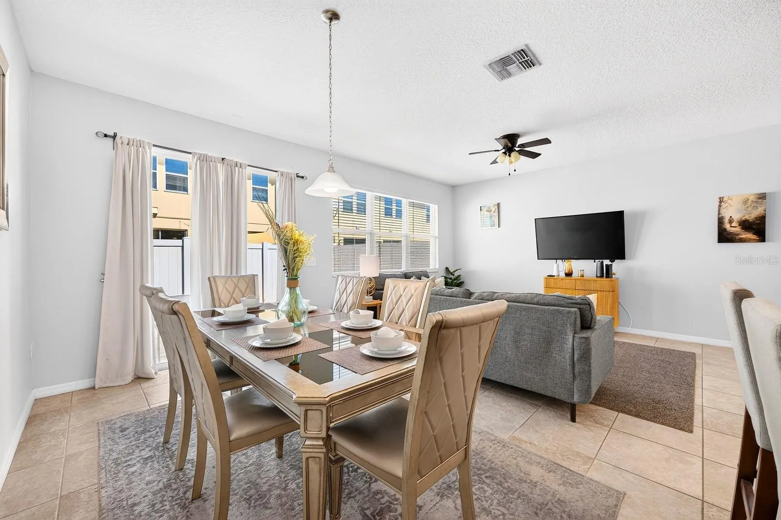Enjoy natural light from the wall of windows.