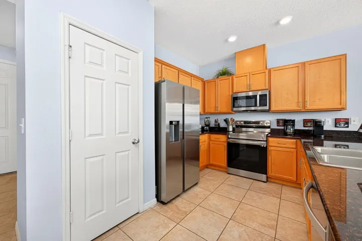 The kitchen delivers stainless steel appliances and ample storage.