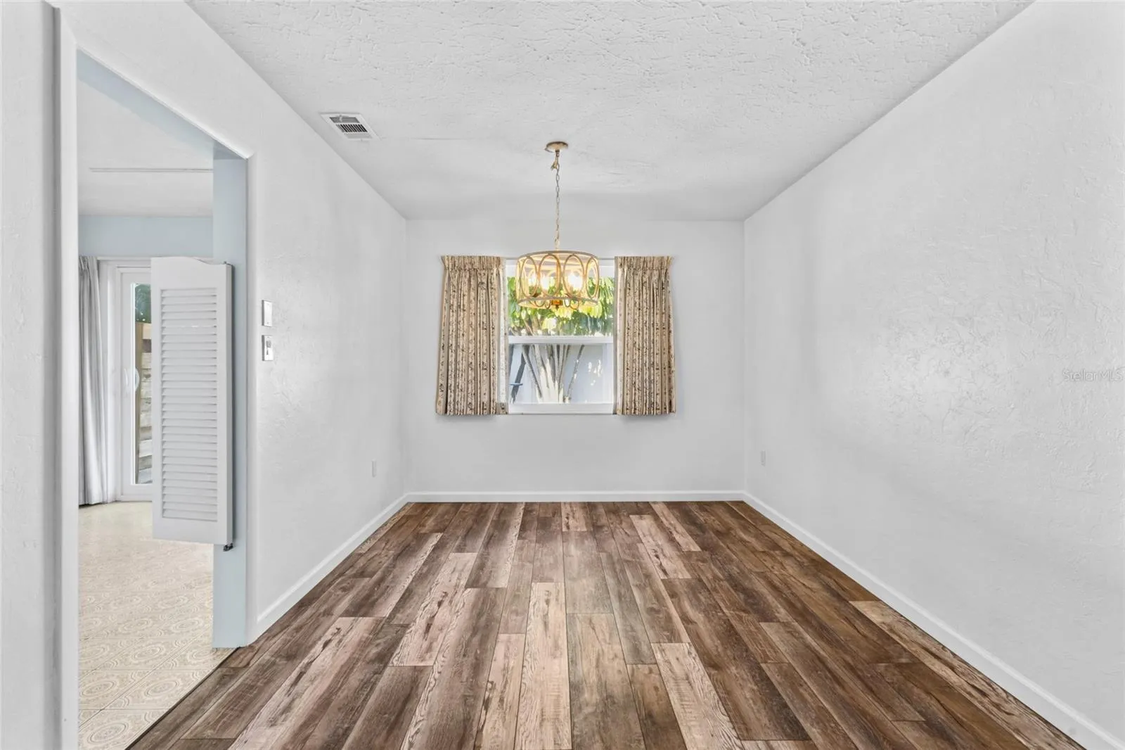 Dining area with kitchen to the left