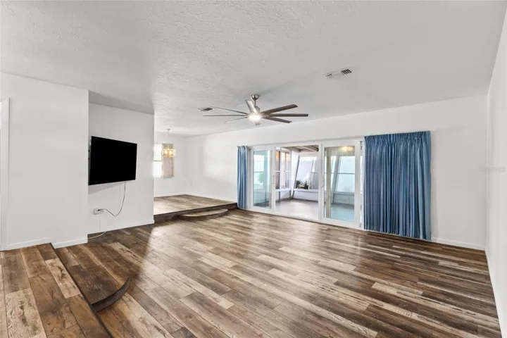 Living room facing the dining area. New sliders out to the FL Room.