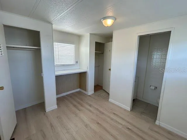 primary bedroom with 2 closets