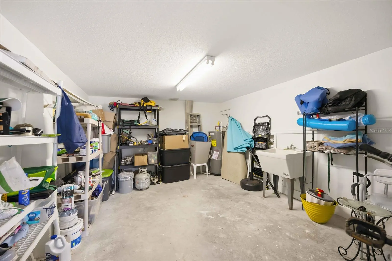 large storage room inside carport / electrical and plumbing