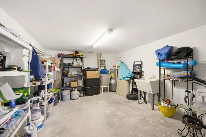 large storage room inside carport / electrical and plumbing