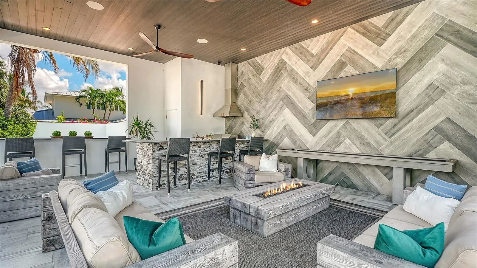 Cabana with an amazing outdoor kitchen, bar and recreation space overlooking the waterfront