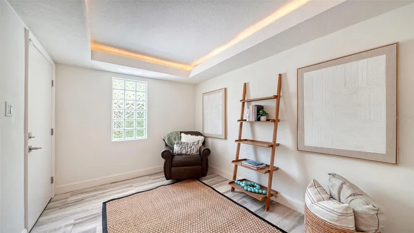 Step in from the garage to a welcoming entry foyer and elevator access