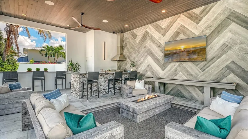 Cabana with an amazing outdoor kitchen, bar and recreation space overlooking the waterfront