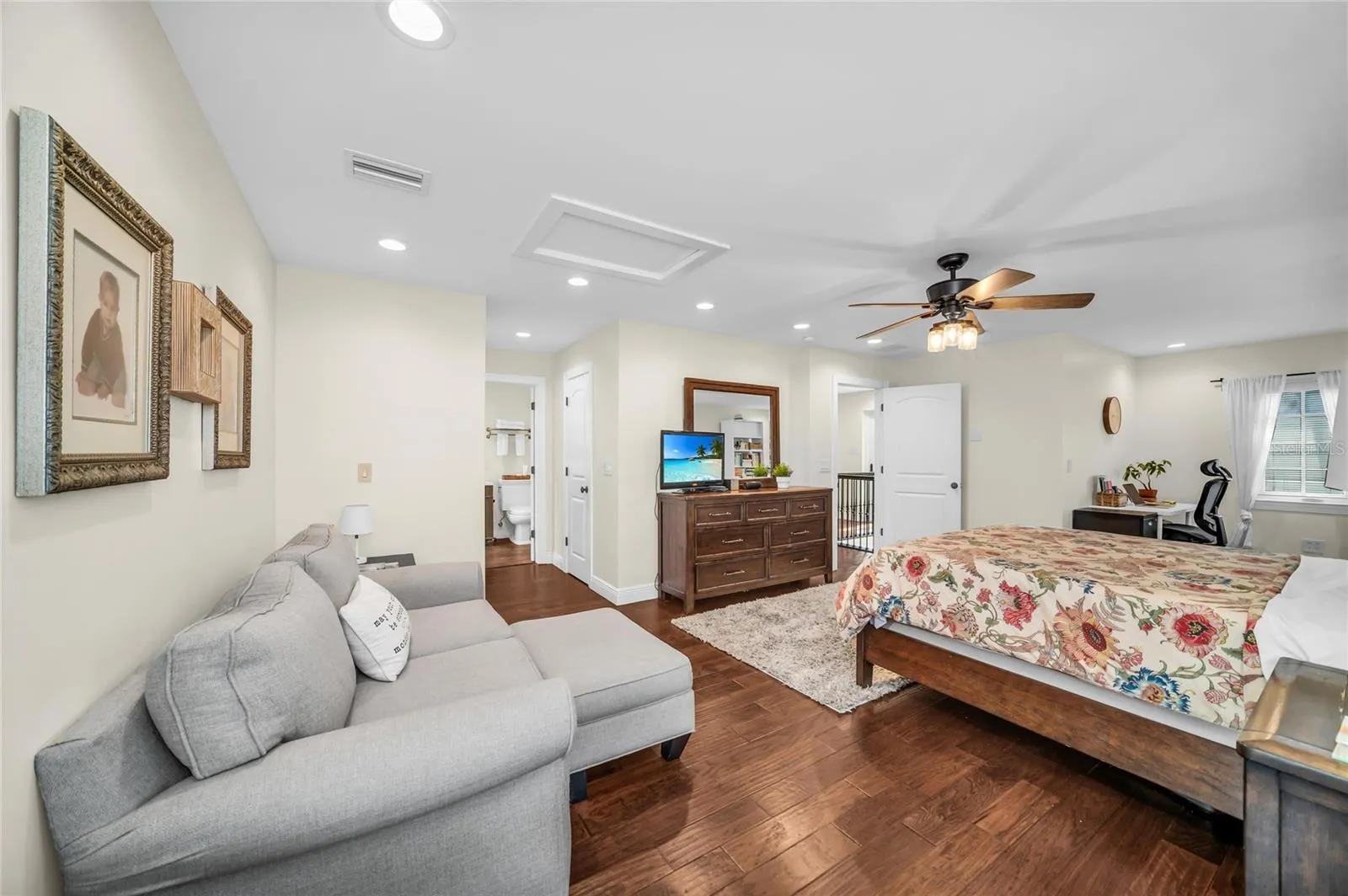 PRIVATE OWNER'S RETREAT featuring a screened porch overlooking the pool and an ensuite bathroom with tub and shower. An additional outdoor shower, accessed from within the full bath brings a touch of resort-style living to the home.