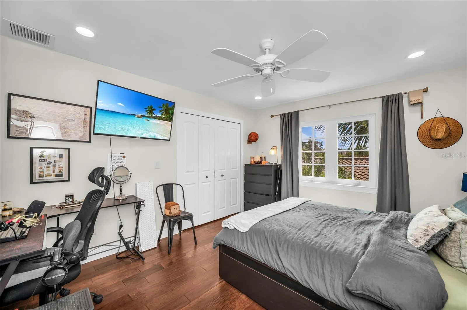 Spacious Bedroom on second level with view of coconut palm.