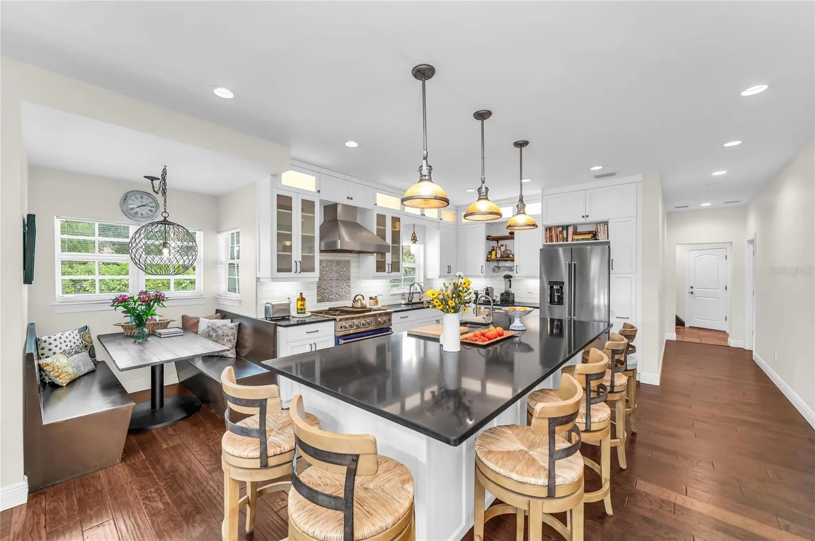 Warm and inviting eat-in-kitchen with the large island that seats 6, and the built-in booth for casual dining or gathering with family and friends.