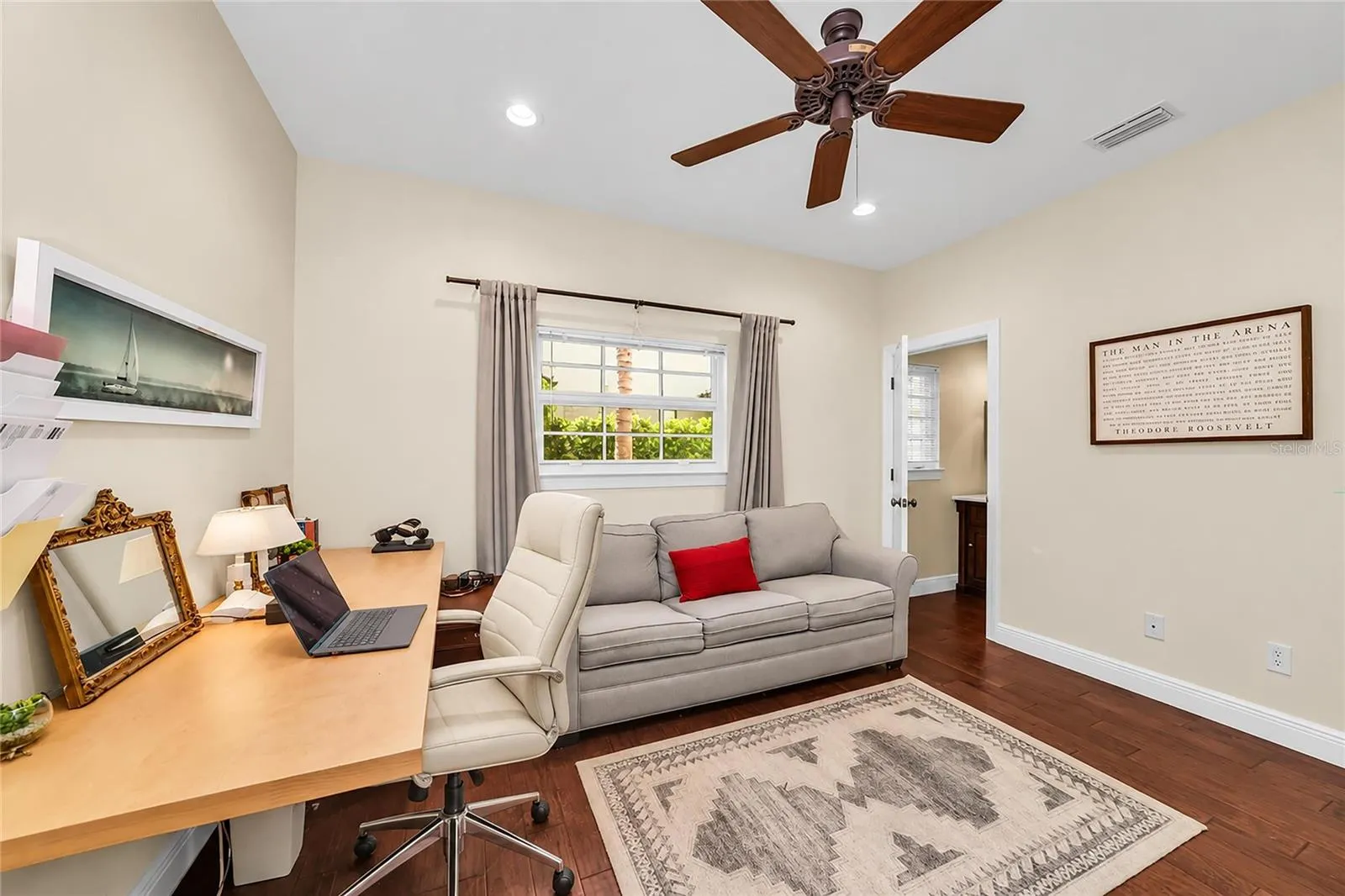 Main level guest bedroom with full bath—currently used as a home office