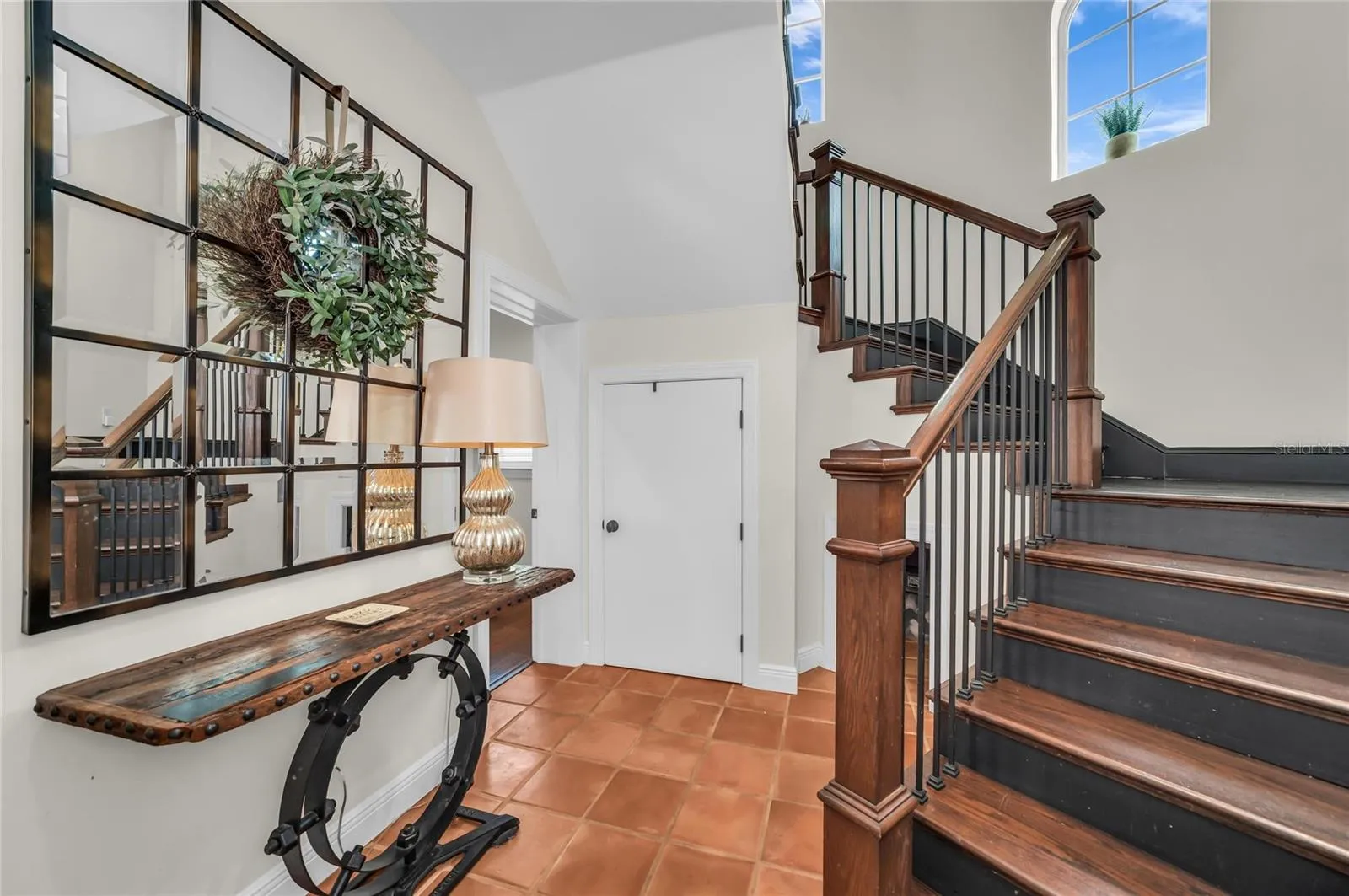 Back foyer that leads to second floor, home gym room and double garage.