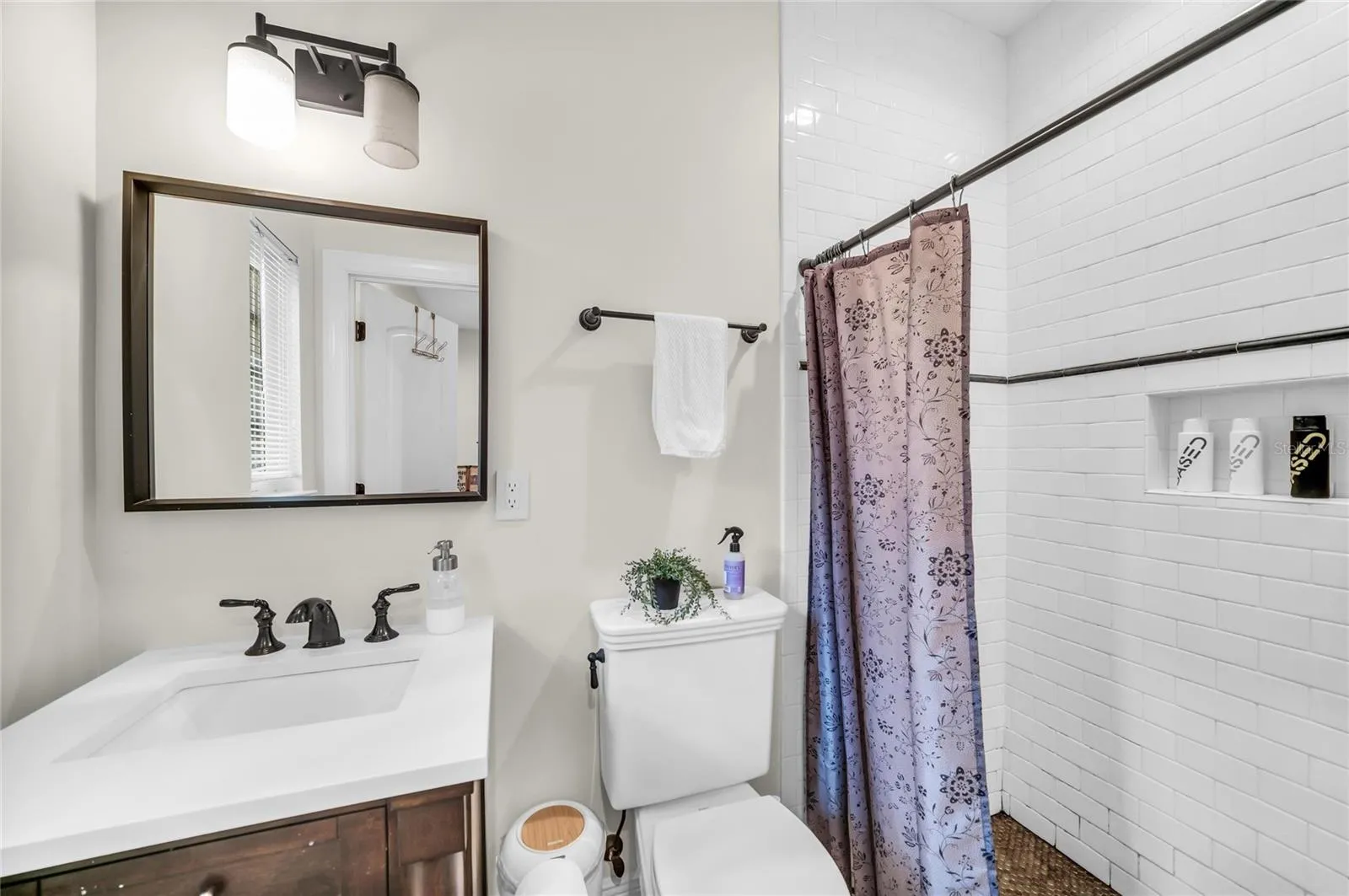 Office or family/guest room bathroom with walk-in shower and single vanity.