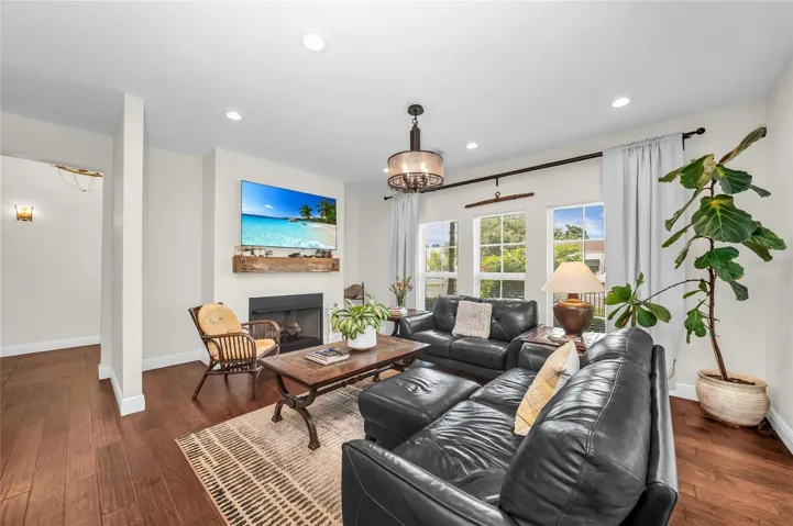 The light filled family room featuring a vent-free gas log fireplace.