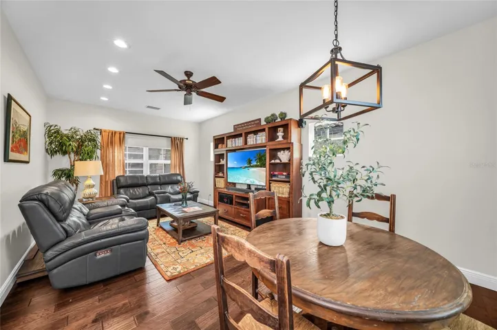 Cozy Living Room/TV room on the main level with room for a game table or dining table.