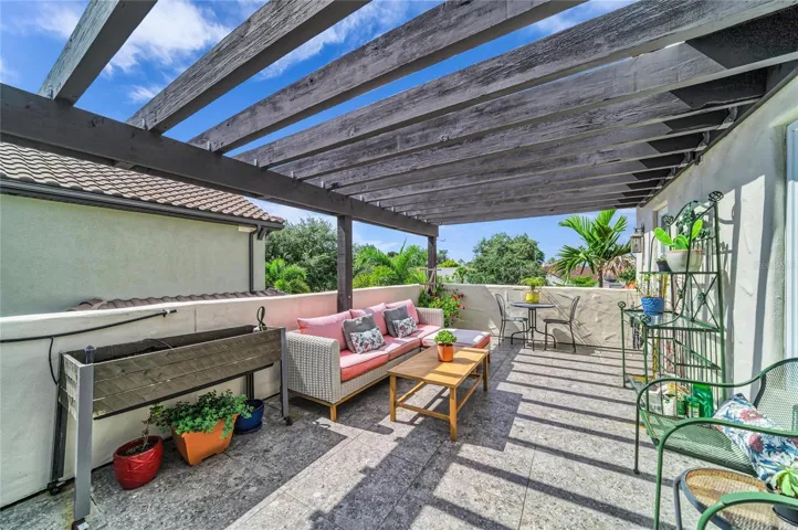 Upper level garden deck with seating areas.