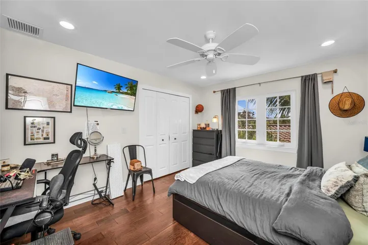 Spacious Bedroom on second level with view of coconut palm.