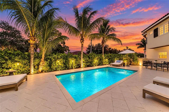 Private tropical setting for relaxing or entertaining. Large salt chlorinated swimming pool with heat/cool pump, auto-fill pool filler, pebble tech epoxy finish, and colored LED pool lights. New in 2024