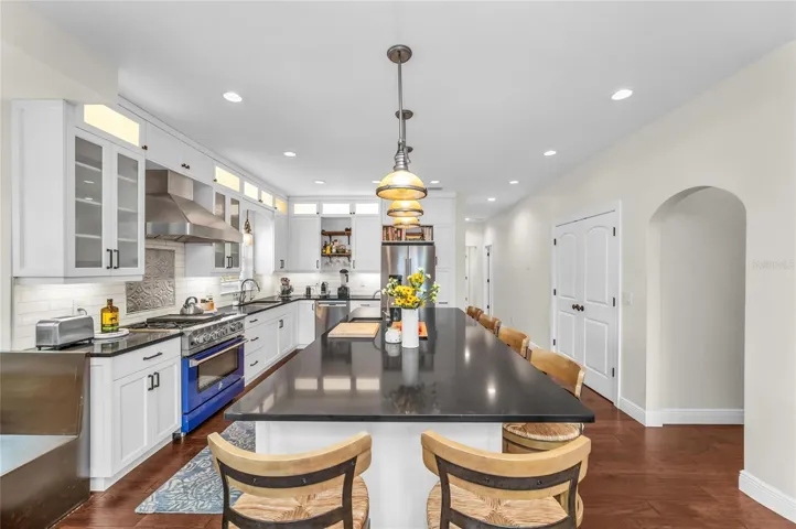 Lot's of light in the beautiful kitchen, windows and lighting.