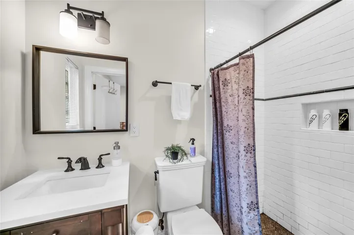 Office or family/guest room bathroom with walk-in shower and single vanity.
