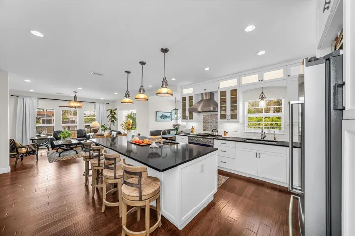The open-concept design seamlessly connects the kitchen, family room and dining areas.