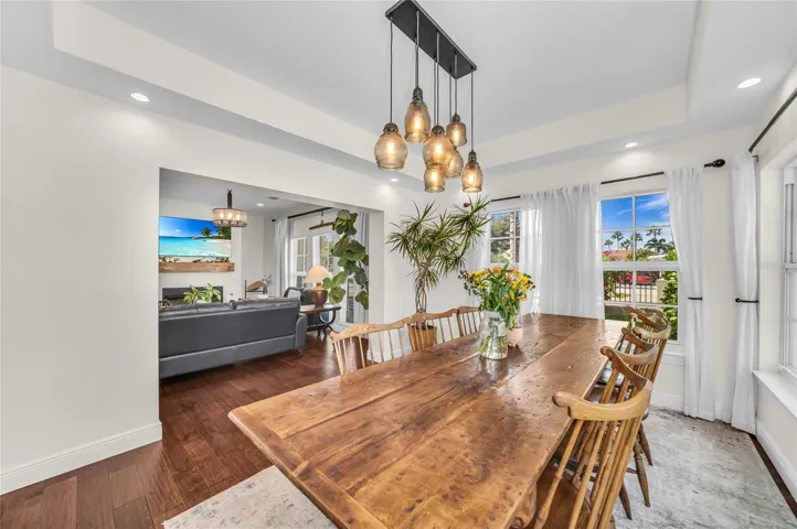 Open to the family room, the dining room offers a relaxed atmosphere with ample space for a large dining table and a beautiful view of the pool.