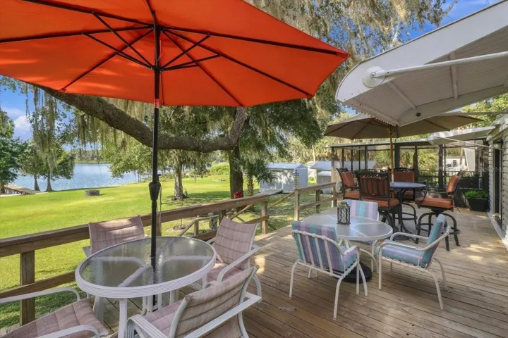 Large outdoor deck for entertaining with gorgeous views of nature and the lake.