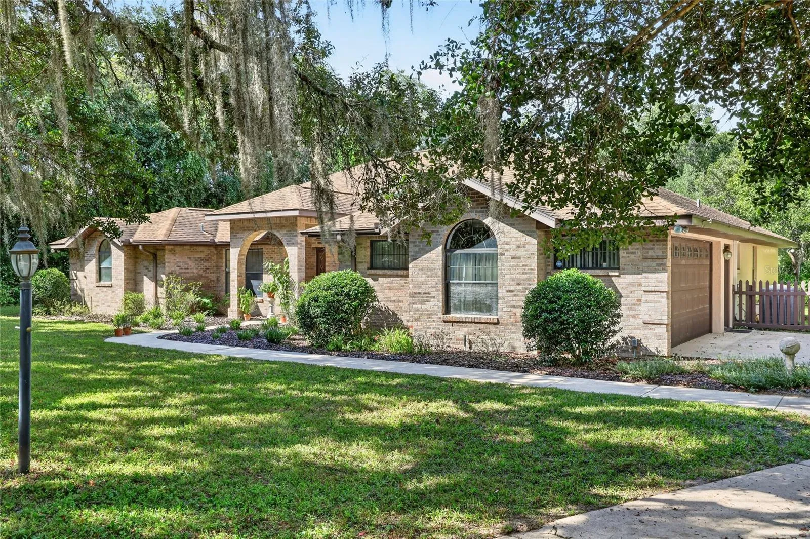 On a one acre parcel with mature trees.