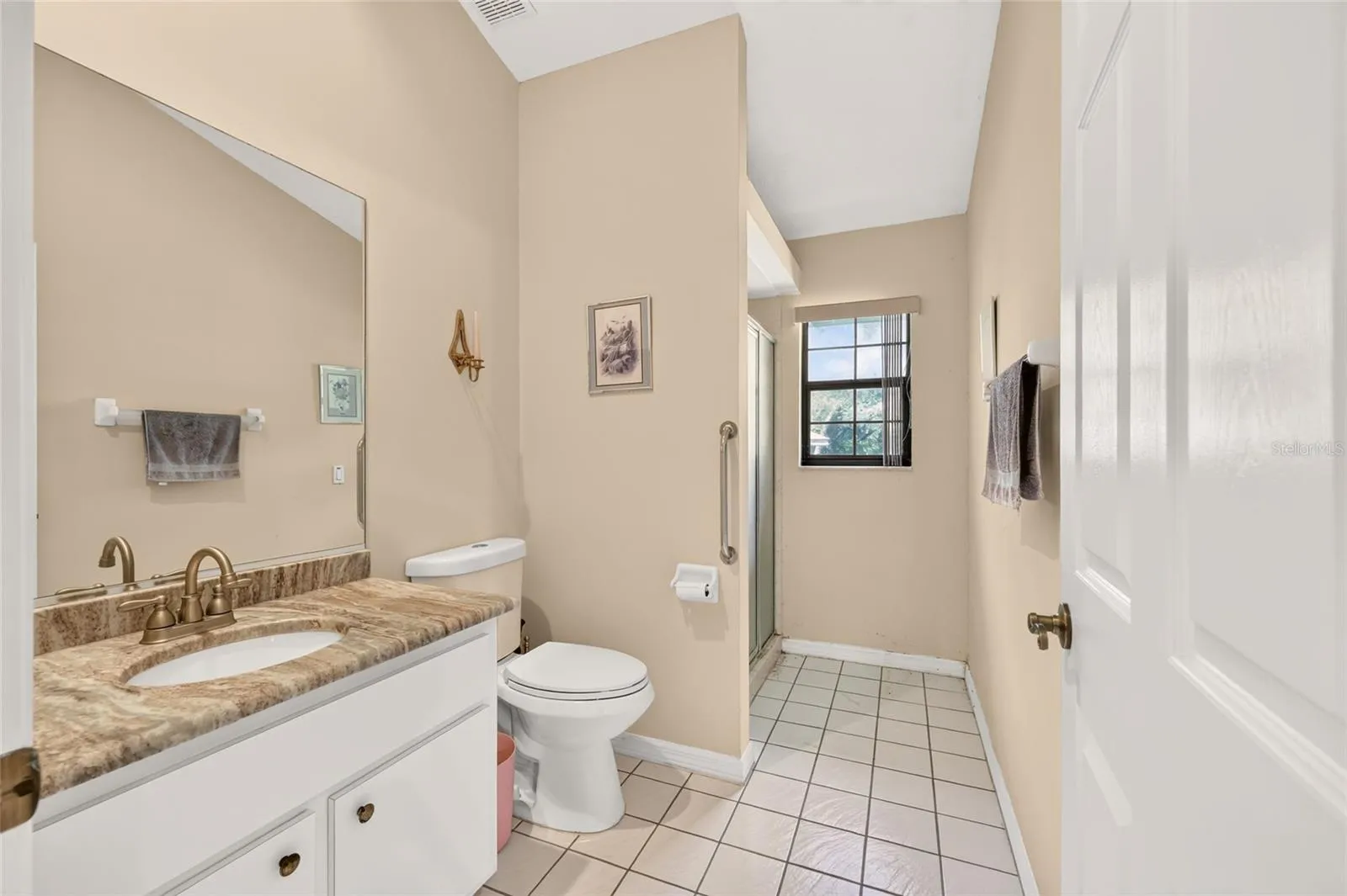 Guest Bathroom with Granite Countertop on vanity.