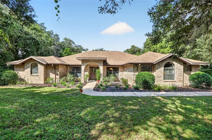 Lovely brick facade and stucco home in desirable Timberwood.