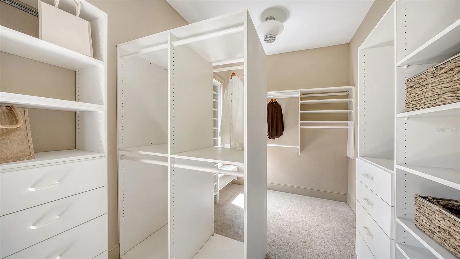 Custom designed storage provides extensive organization within the private primary suite level.