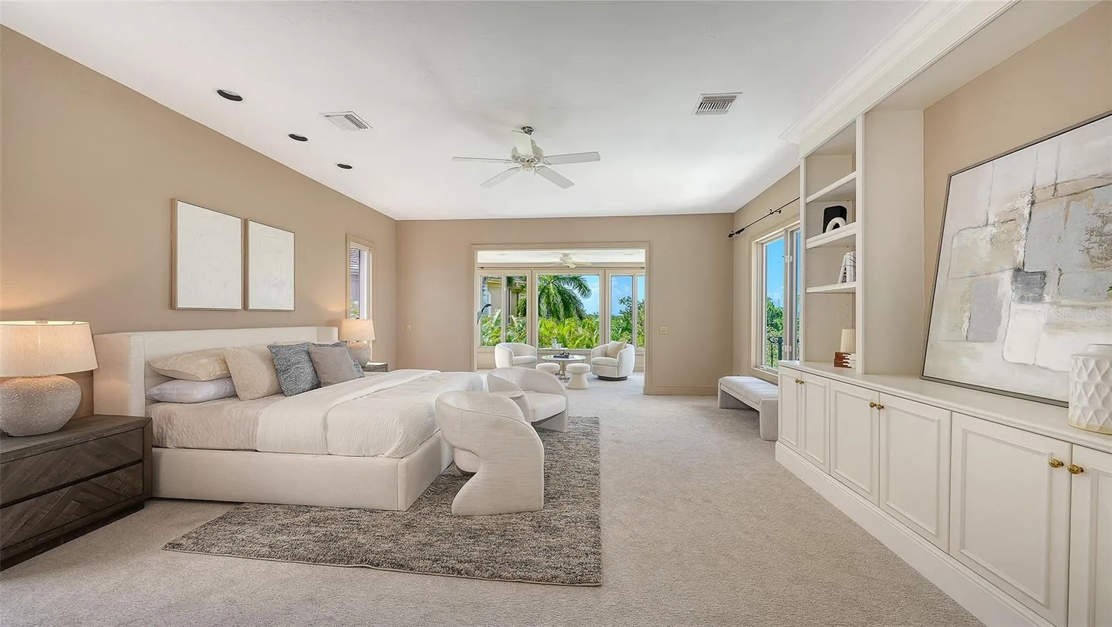The primary suite occupies its own private level with generous proportions, custom built ins and a separate sitting area.