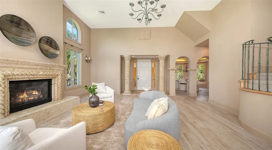 A fireplace, custom millwork and graceful architectural elements bring warmth and character to the main living area.