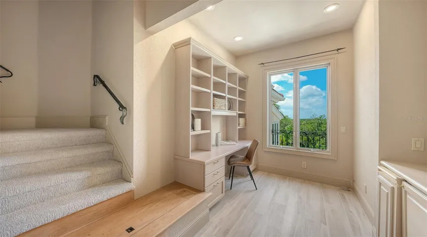 Built in workspace and storage create an ideal setting for a home office, study or additional media area.