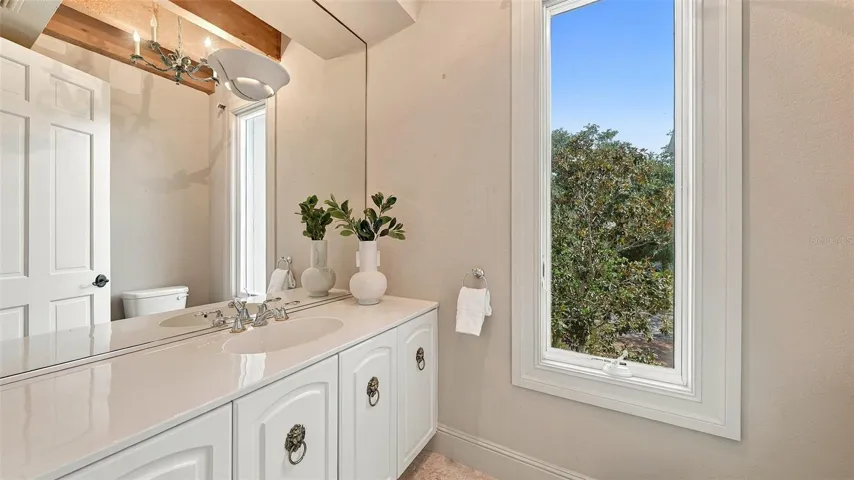 A beautifully finished powder room adds convenience for residents and guests.