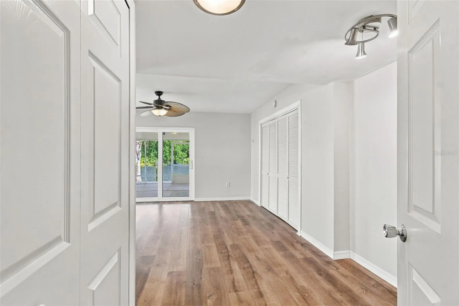 primary bedroom, sliders to screened porch