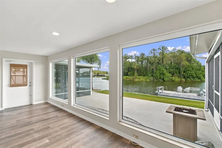 FAMILY ROOM VIEW, Back patio, screened porch on each side.
