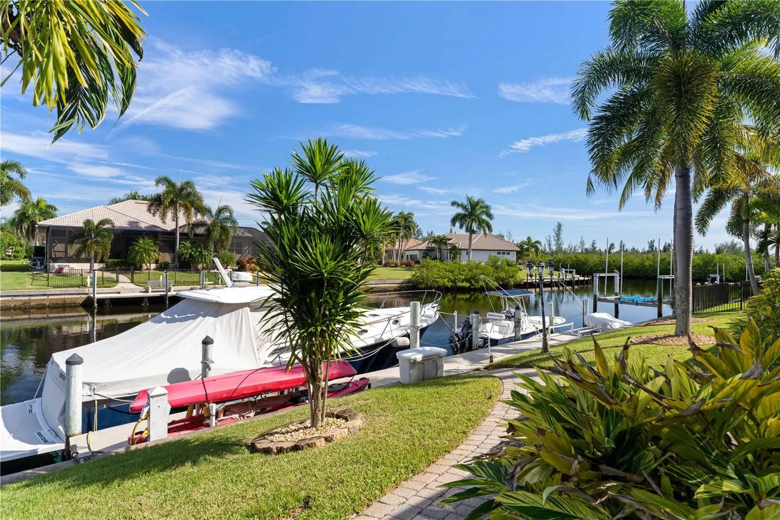Brick paver walkway leads to private dock